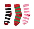 Different striped socks on white background, top view