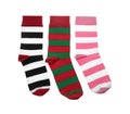 Different striped socks on white background, top view