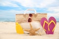 Stylish beach objects and starfishes on sand near sea Royalty Free Stock Photo