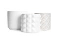 Different stylish ceramic flowerpots on white