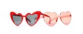 Different stylish heart shaped glasses on white