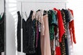 Different stylish women`s clothes on rack indoors Royalty Free Stock Photo