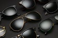 Different sunglasses on black background Royalty Free Stock Photo