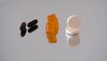 Different supplement forms on reflective surface capsules, gummies and tablets Royalty Free Stock Photo