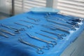 Different surgical instruments on blue table indoors Royalty Free Stock Photo