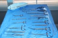 Different surgical instruments on blue table Royalty Free Stock Photo