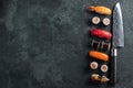 Different Sushi with Japanese knife on concrete Royalty Free Stock Photo