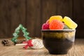 Different sweet candies on rustic wooden table