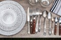 Different tableware and cutlery on wooden table, flat lay. Garage sale Royalty Free Stock Photo