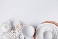 Different tableware and dishes on the white background, top view. Royalty Free Stock Photo