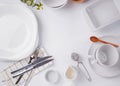 Different tableware and dishes on the white background, top view. Royalty Free Stock Photo