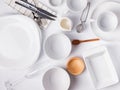 Different tableware and dishes on the white background, top view. Royalty Free Stock Photo