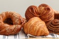 Different tasty freshly baked pastries on table