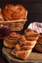 Different tasty freshly pastries on table, closeup