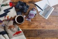 Different things for travel on a wooden background. Soviet retro camera and postcard Czech Republic and a cup of coffee.