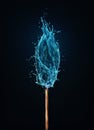 Different thinking concept as an unusual matchstick burning in a water flame. Blue liquid splash drops on a match, instead of fire