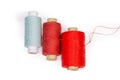 Different threads spools, hand sewing needle with thread, top view