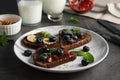Different toasts with fruits, blueberries, honey and chia seeds