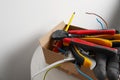 Different tools and cables in paper indoors. Installation of electrical wiring Royalty Free Stock Photo