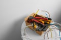 Different tools and cables in paper indoors. Installation of electrical wiring Royalty Free Stock Photo