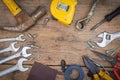 Different tools supplies on a wooden background