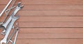 Different tools on a wooden plank background with copy space Royalty Free Stock Photo