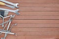 Different tools on a wooden plank background with copy space Royalty Free Stock Photo