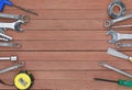 Different tools on a wooden plank background with copy space Royalty Free Stock Photo