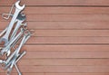 Different tools on a wooden plank background with copy space Royalty Free Stock Photo