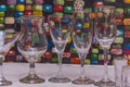 DIFFERENT TYPE OF DRINKING GLASSES SITTING COLORFUL TABLE Royalty Free Stock Photo