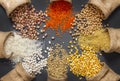 Different type of raw dry legumes composition. White beans, lentils, bulgur, chickpeas, kidney beans, corns, rice Royalty Free Stock Photo