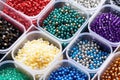 different types of beads, such as wood, plastic, and metal in separate containers