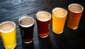 Different types of beers. Ale, dark, light and unfiltered beer and lager, in glasses