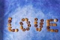 Different types of bisquits forming love word Royalty Free Stock Photo