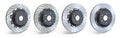 Different types of brake disks. Drilled and slotted brake disks in a row