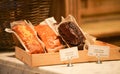 Different types of bread like pastry handmade cakes in the window of a bakery store. Royalty Free Stock Photo