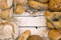 Different types of bread on white wooden board Royalty Free Stock Photo