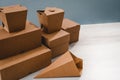 Different types of brown cardboard packaging. For fast food, folding, large and small. The concept of production and design of