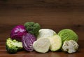 Different types of cabbage on wooden table Royalty Free Stock Photo
