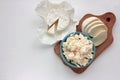 Different types of cheese on white table. Overhead view of cottage cheese, mozzarella, and camembert. Copy space.