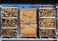 Different types of chopped firewood in packing on three pallets Royalty Free Stock Photo