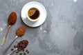 Coffee beans, ground and instant coffee in the spoons and a cup of fresh espresso Royalty Free Stock Photo