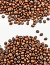 Coffee beans displayed in various roasts and colors on a white background showcasing their texture and variety for Royalty Free Stock Photo