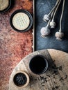 Different types of cookies and cup of coffee on grey and teracota background Royalty Free Stock Photo