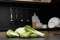 Different types of cut cabbage on grey table in kitchen, space for text Royalty Free Stock Photo