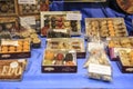 Different types of delicious cakes and cookies made by nuns in pastry shop showcase