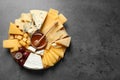 Different types of delicious cheese and snacks on served grey table, top view. Space for Royalty Free Stock Photo