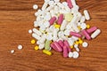 Different types of drugs are scattered on the table. Treatment of diseases with modern methods. Homeopathic and chemicals.