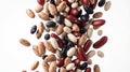 Different types of dry beans falling on white background Royalty Free Stock Photo