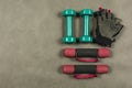 Different types of dumbbells and fingerless gloves.